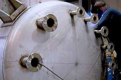 Custom-Fabrication-Solutions_Welder-working-on-specialty-custom-asme-vessel-thumb
